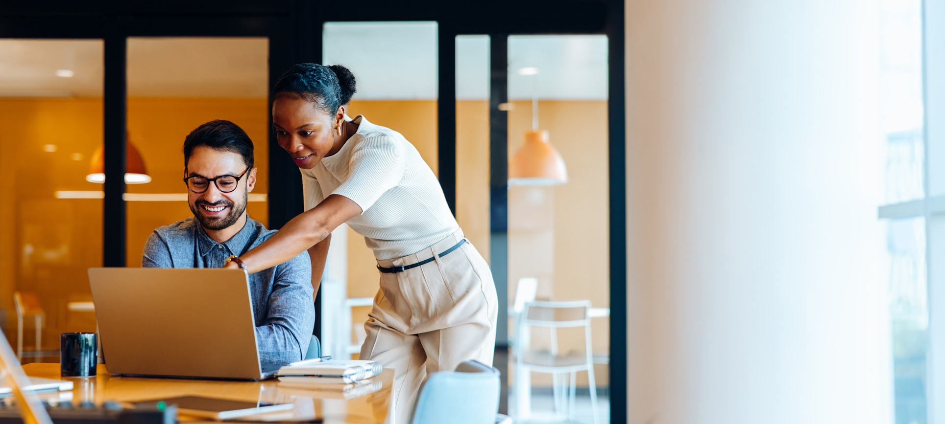 Team members discussing project action items to make a plan with coworker