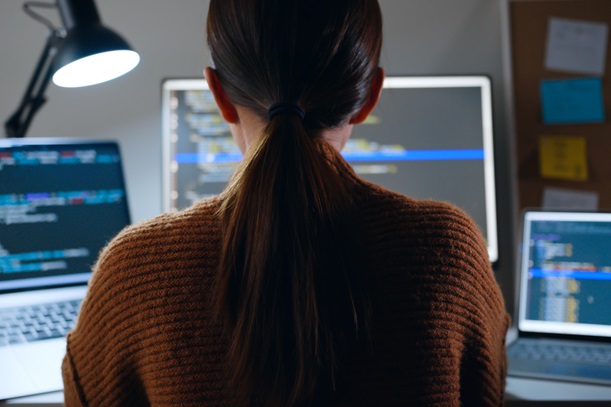 Microsoft Endpoint user working on her laptop in office